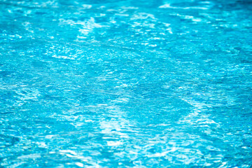 Blue ripped water in swimming pool, water pool texture and surface water backgraund.