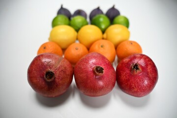 Fresh rainbow arrangement of fruits, perfect for blog posts, articles, and media content about nutrition, healthy lifestyle, and diet tips.