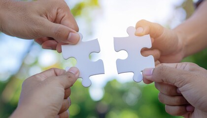 Two hands holding puzzle pieces about to connect.