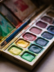 Colorful Watercolor Paint Palette Close-up - Artist Gouache Colors and Creative Art Supplies in Action.