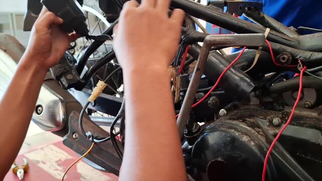 Mechanic Replacing or Checking CDI Unit and Motorcycle Wiring Harness