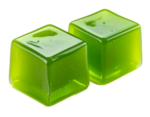 Two vibrant green, cube-shaped, translucent candies (1)