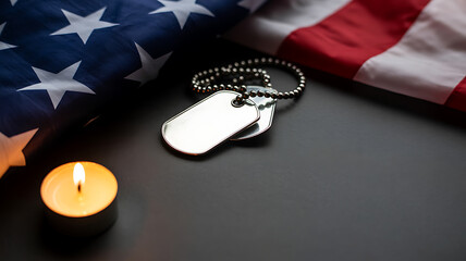 American flag with military dog tags and a lit candle on a dark surface