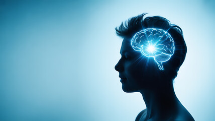 Silhouette of a human head with a glowing brain illustration, symbolizing neural activity and cognitive function