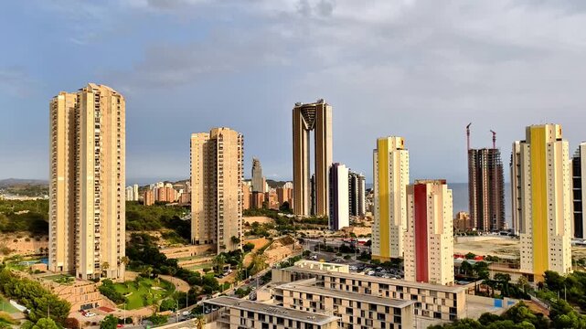 A breathtaking urban skyline reveals a captivating display of modern highrise buildings surrounded by lush greenery