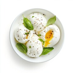 Creamy Poached Eggs with Fresh Basil and Pepper on White Dish
