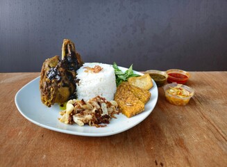 chocolate chip cookiesNasi bebek set menu is deep fried duck served with rice,fried tempeh,fried tofu,fried cabbage,fresh vegetables and sambal or chili sauce and mango sambal Indonesian traditional f