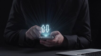 A businessman interacts with a smartphone showcasing digital arrows representing the relationship between quality and cost in contemporary business practices. Qubit