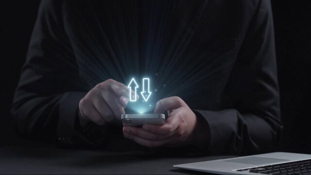 A businessman interacts with a smartphone showcasing digital arrows representing the relationship between quality and cost in contemporary business practices. Qubit