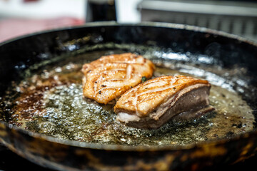 Duck breast fillet frying in pan