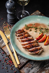 Gourmet duck breast with wine and peaches