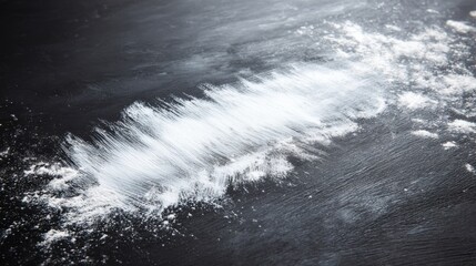 Flour Spread Across a Dark Surface in a Kitchen Preparing for Baking Activities With Cooking Tools Scattered Around