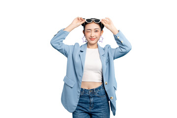 portrait Asian Woman  winking and holding sunglasses. She is wearing a blue blazer and denim jeans...