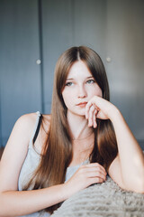 Fototapeta premium Portrait of a beautiful girl with green eyes, the girl has long hair