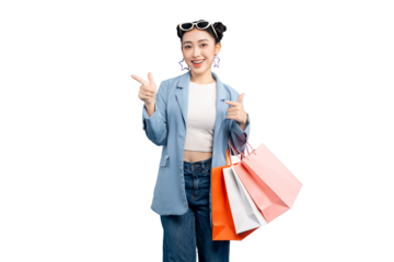 portrait Asian Woman  happy holding shopping bags and pointing her finger. She is wearing stylish outfit with a smiling face and thumbs up gesture on PNG