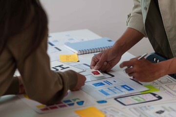 Hands Collaborating on UX UI Design Prototypes