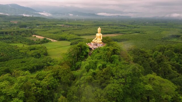 &ldquo;Phra Phuttha Sihingkhiri Sritat Buddha &ndash; Golden Statue on Khao Phra Mountain, Phipun, Thailand&rdquo;
