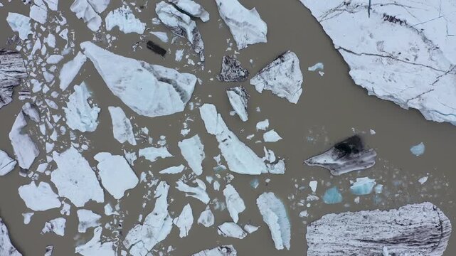  Aerial slow motion view of melting glacier and floating icebergs as result of Atlantic ocean meridian overturning circulation Gulf stream collapse