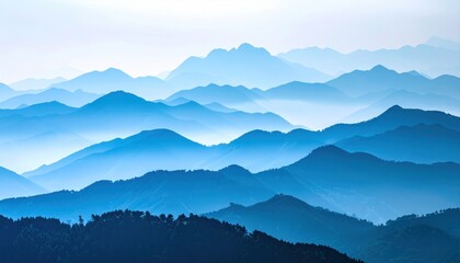 Layers of blue mountain ridges receding into a hazy, distant horizon create a sense of depth and serene natural grandeur