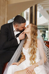 happy bride and groom in the lobby of the hotel on the day of the wedding