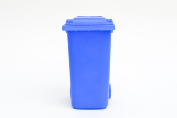 Rubbish bin garbage square shape dark blue with flip cover and casters isolated on white background. Waste collection equipment in park.