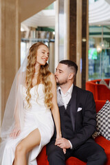 happy bride and groom in the lobby of the hotel on the day of the wedding