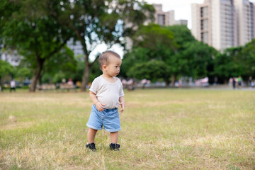 Fototapeta premium Baby son play in the park
