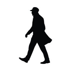Silhouette of a man wearing a hat and coat walking
