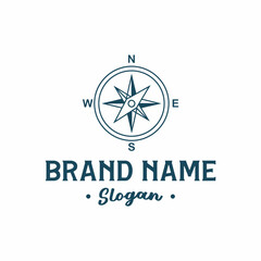 Vintage style compass rose logo with brand name and slogan.