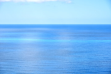 Obraz premium View of the open blue sea with blue sky. Beautiful seascape panorama. Copy space.
