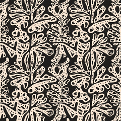 Seamless abstract pattern featuring organic, flowing shapes in beige on a black background, resembling stylized foliage.