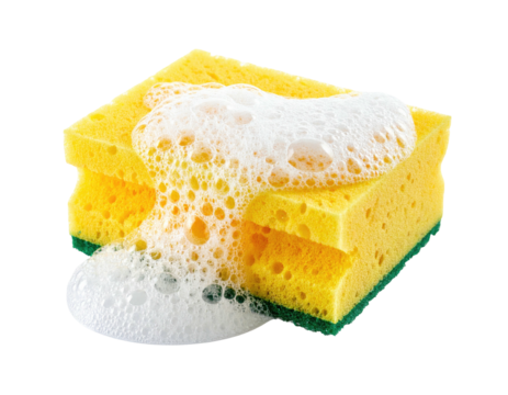 A yellow cleaning sponge with a generous amount of white suds dripping from it