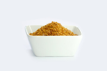 Flaxseed in a bowl on a white background. Roasted and finely ground, fine texture. Benefits: Relieves hot flashes and reduces inflammation that can cause Parkinson's Disease and asthma.