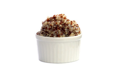 Quinoa soaked in boiling water until foamy. White, red, and black quinoa seeds in a bowl on a white background. Quinoa may help control blood sugar levels.