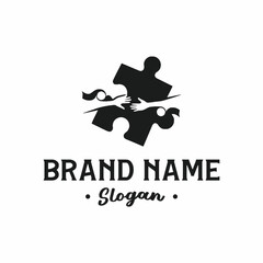 Logo featuring a black puzzle piece with hands reaching out, symbolizing connection and teamwork, with brand name and slogan.