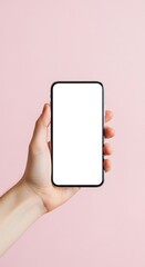 A modern smartphone held in a hand against a soft, pastel pink backdrop, showcasing a blank white screen.