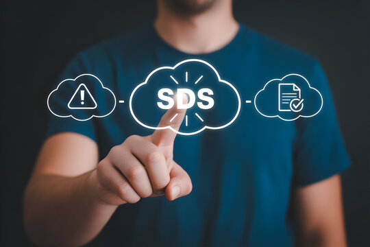 Person touching virtual SDS icon with hazard alert and document symbols representing safety data sheet information management