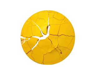 A circular, yellow object with extensive, radiating cracks