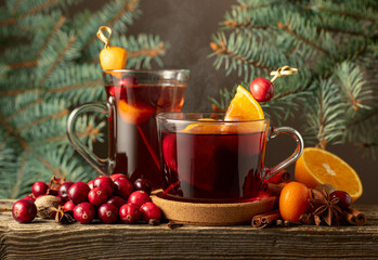 Winter drinks with spices, cranberries, and citrus fruits.