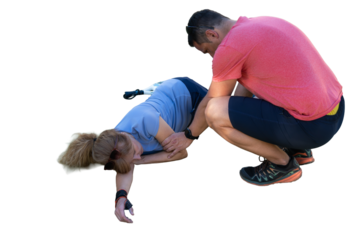 Man helping injured woman after falling during exercise