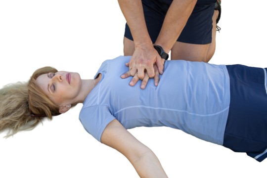 Person performing cpr on unconscious woman heart attack