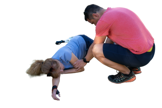 Man helping injured woman after falling during exercise