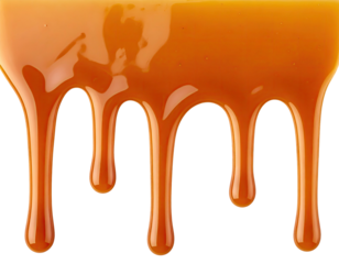 Caramel sauce drips downward against a black background