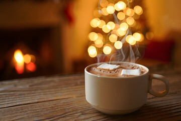 Cozy Winter Delight: A warm mug of cocoa with marshmallows steams invitingly on a wooden table, against the backdrop of a softly glowing Christmas tree and a cozy fireplace.