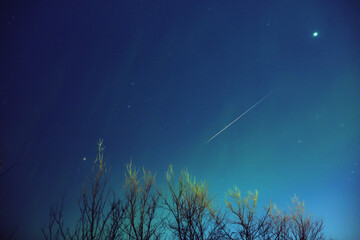 Aurora borealis, polar lights with Milky Way stars.