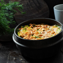 Stew boiling in an earthenware pot