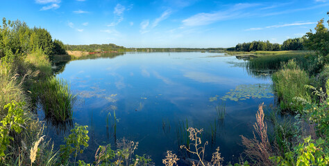 A lake with a blue sky in the background