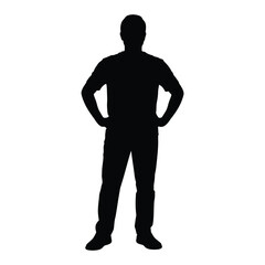 Silhouette of a man standing with hands on hips