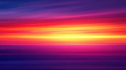 Vibrant sunset paints sky with fiery orange, pink, and purple hues over tranquil ocean
