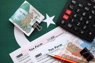 Pakistan rupees banknotes and medicine pills. Pakistan real money and tax blank close up